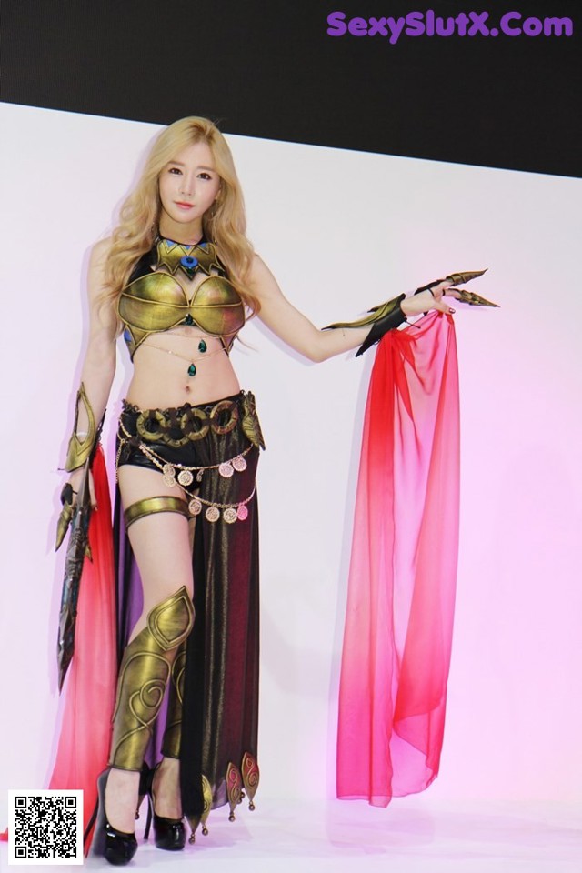 A woman in a costume is posing for a picture.